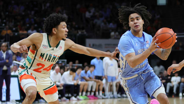 North Carolina Tar Heels guard Elliot Cadeau (2) drives to the basket against Miami Hurricanes guard Nijel Pack (24)